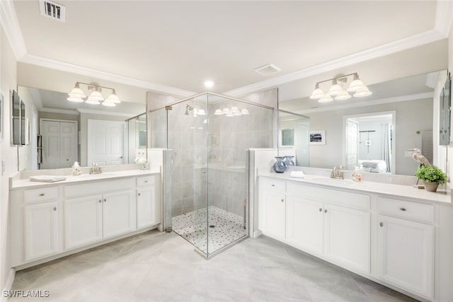 bathroom featuring an enclosed shower, vanity, and crown molding