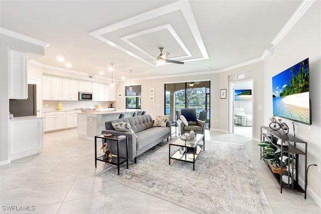 living room featuring ceiling fan, light tile patterned floors, and crown molding