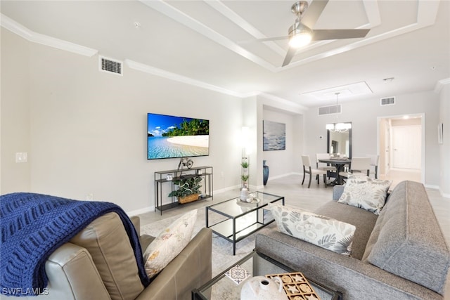 living room with ceiling fan and crown molding