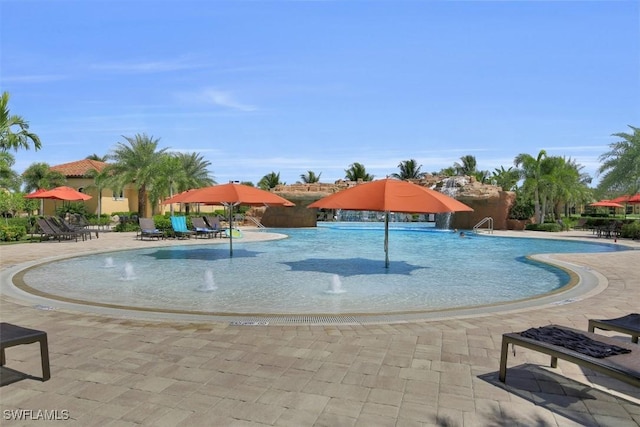 view of pool with pool water feature