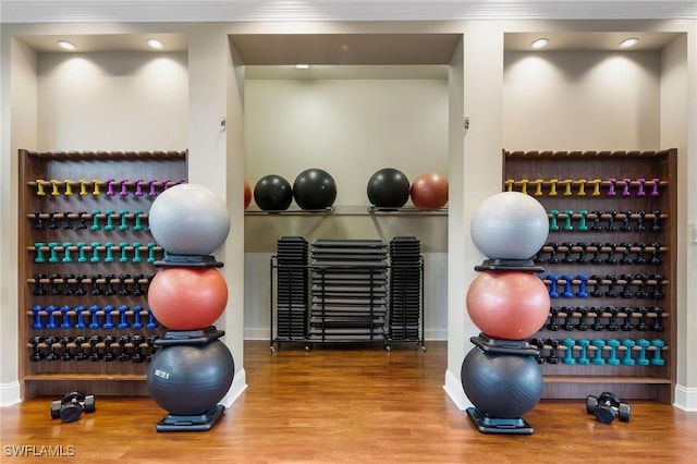 exercise area with hardwood / wood-style flooring