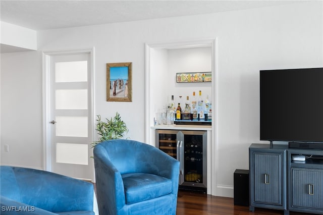 interior space with dark wood-type flooring, wine cooler, and indoor bar