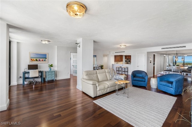 living room featuring dark hardwood / wood-style flooring