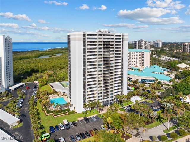 birds eye view of property with a water view