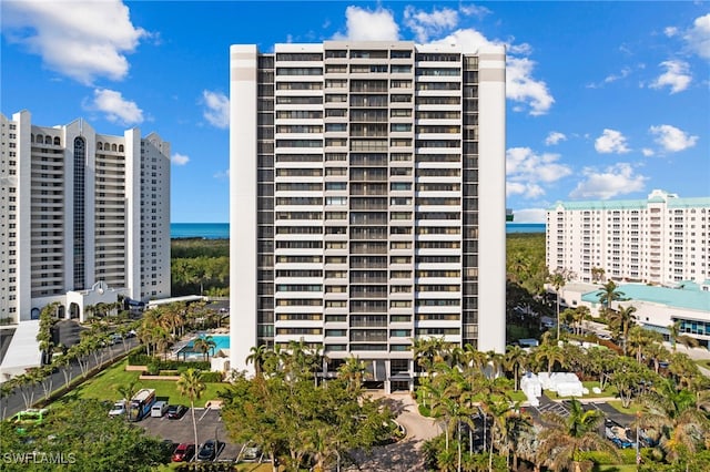 view of building exterior with a water view