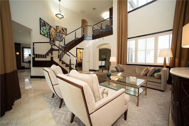 living room with a high ceiling