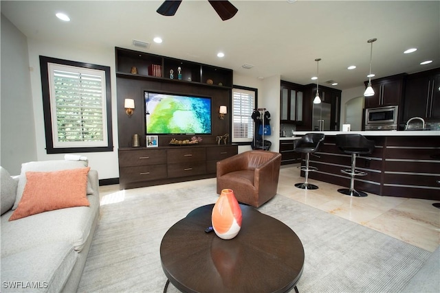 interior space featuring ceiling fan