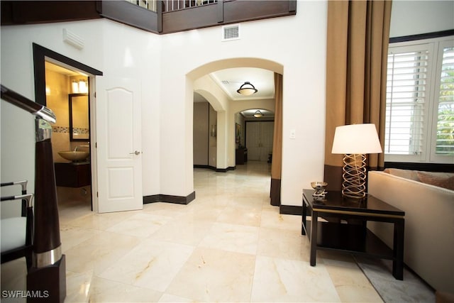 hallway featuring crown molding