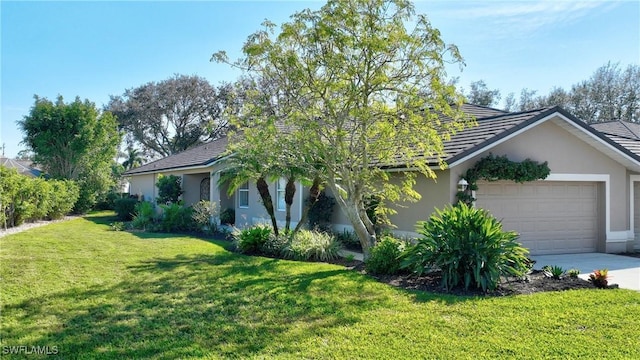 view of front of home with a garage and a front yard