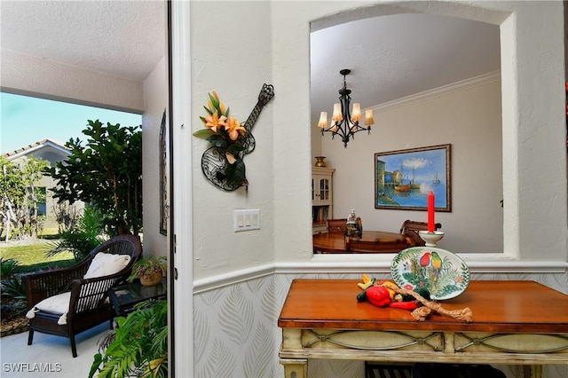 dining space featuring a notable chandelier and crown molding