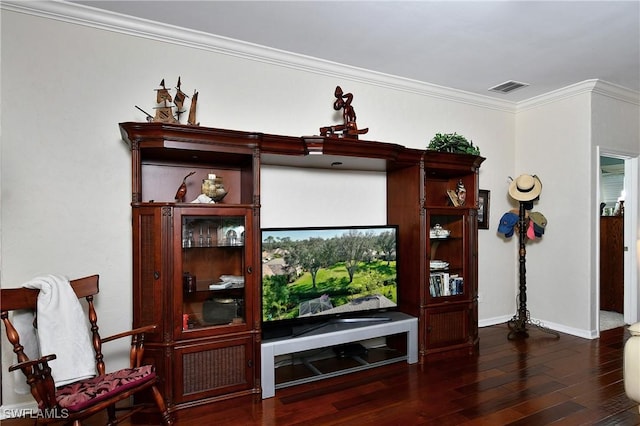 living room featuring dark wood-type flooring and ornamental molding