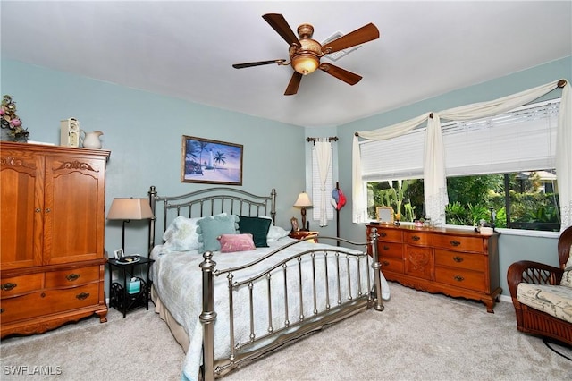 bedroom with light colored carpet and ceiling fan