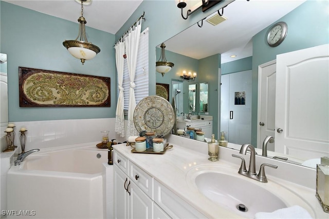 bathroom with vanity and a bathing tub