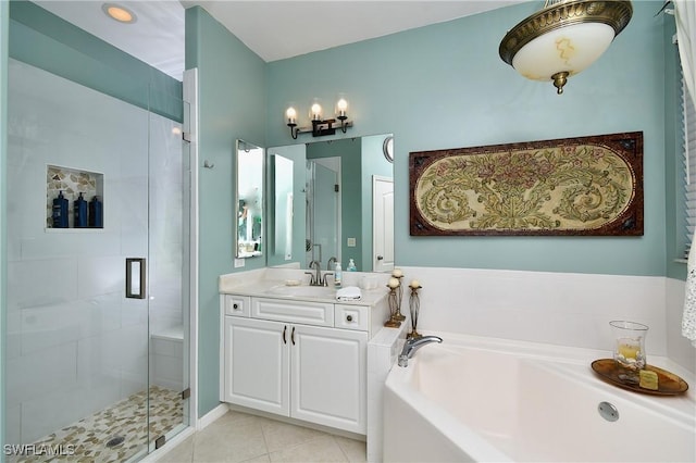 bathroom featuring vanity, shower with separate bathtub, and tile patterned floors