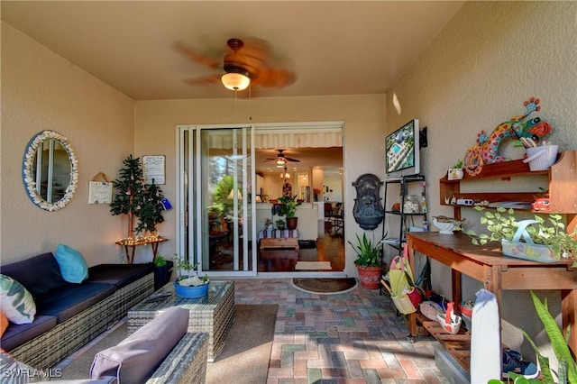 exterior space with ceiling fan