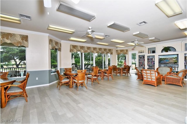 sunroom / solarium with ceiling fan