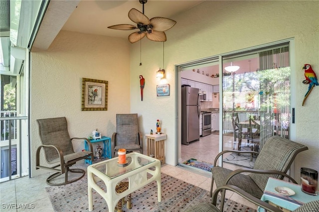 interior space featuring ceiling fan and a healthy amount of sunlight