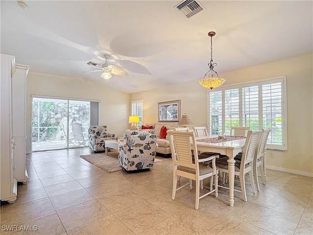 dining area featuring ceiling fan and light tile patterned floors