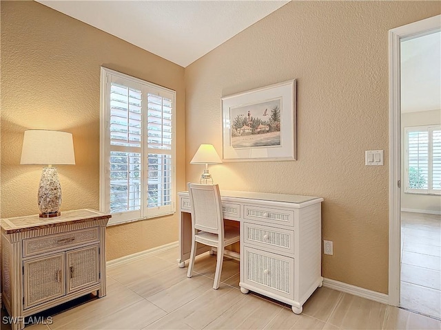 office space with vaulted ceiling