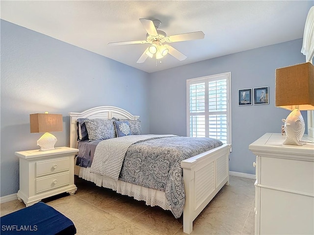 tiled bedroom featuring ceiling fan