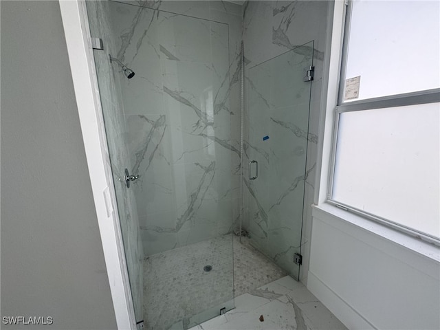 bathroom featuring an enclosed shower