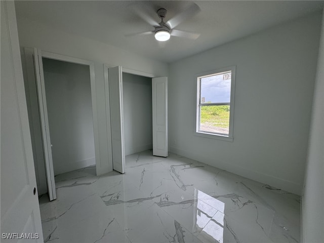 unfurnished bedroom featuring ceiling fan and a closet