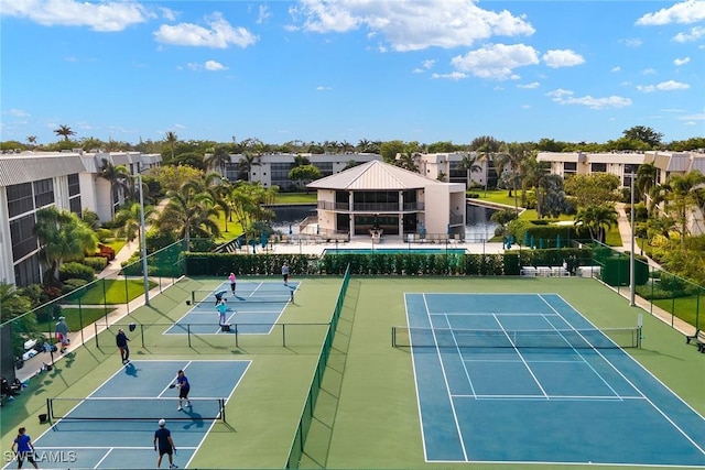 view of tennis court featuring basketball court