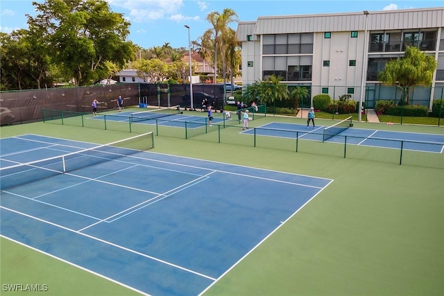 view of sport court with basketball hoop