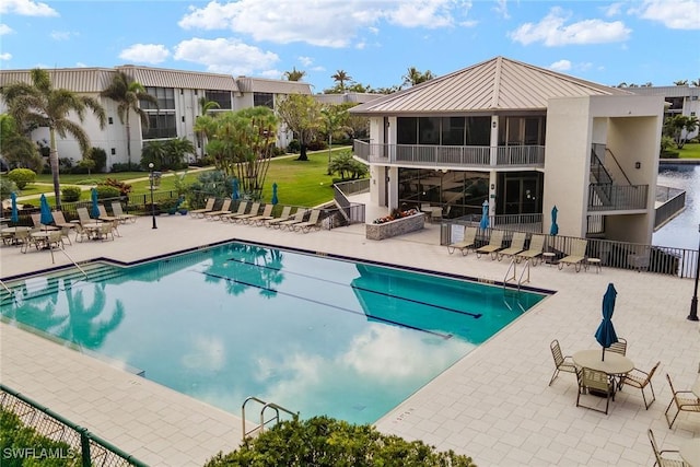 view of swimming pool featuring a patio area