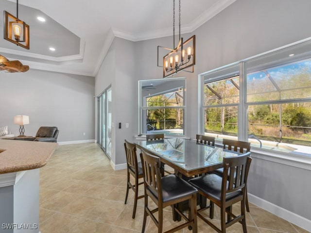 dining space with crown molding, light tile patterned flooring, and a notable chandelier