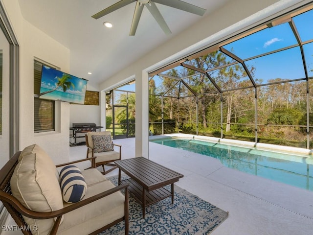 exterior space featuring ceiling fan and a swimming pool