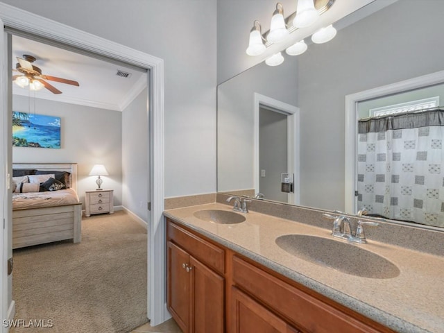 bathroom with vanity, ceiling fan, and ornamental molding