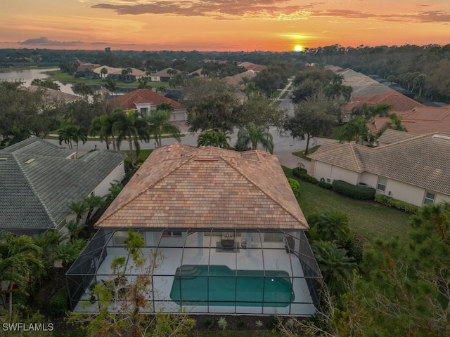 aerial view at dusk with a water view