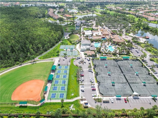 birds eye view of property with a water view