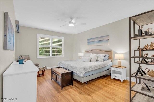 bedroom featuring hardwood / wood-style floors and ceiling fan