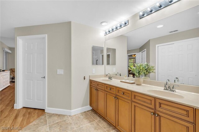 bathroom with tile patterned floors and vanity