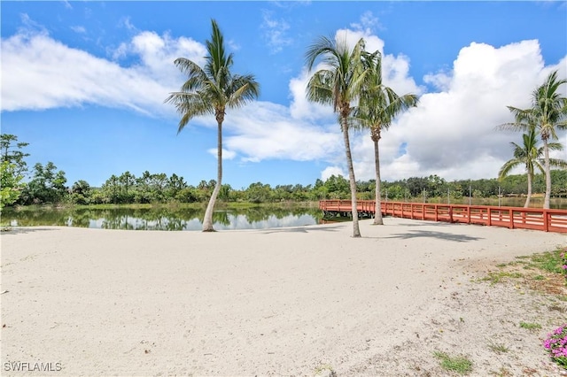 surrounding community featuring a water view