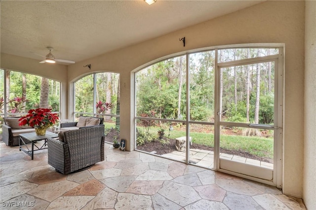 sunroom / solarium with ceiling fan