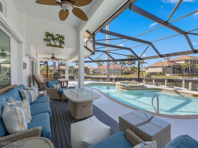 view of pool featuring an in ground hot tub, a patio, an outdoor living space, and glass enclosure