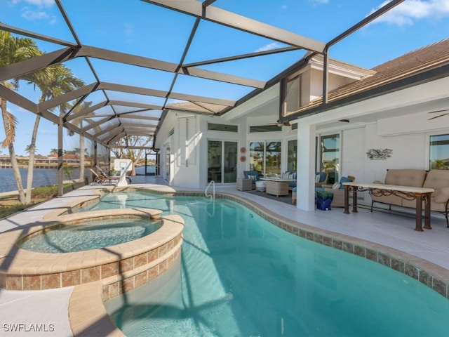 view of pool featuring glass enclosure, an in ground hot tub, a water view, and an outdoor hangout area