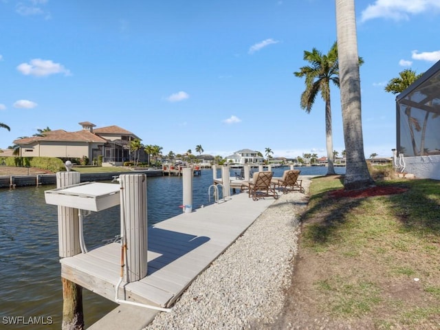 dock area featuring a water view and a lanai