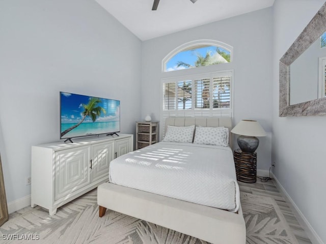 bedroom with ceiling fan and vaulted ceiling