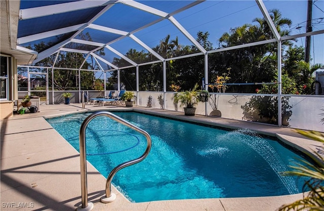 view of swimming pool with a lanai and a patio