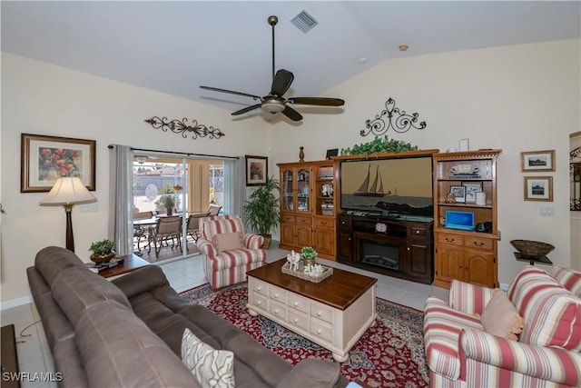 tiled living room with vaulted ceiling and ceiling fan