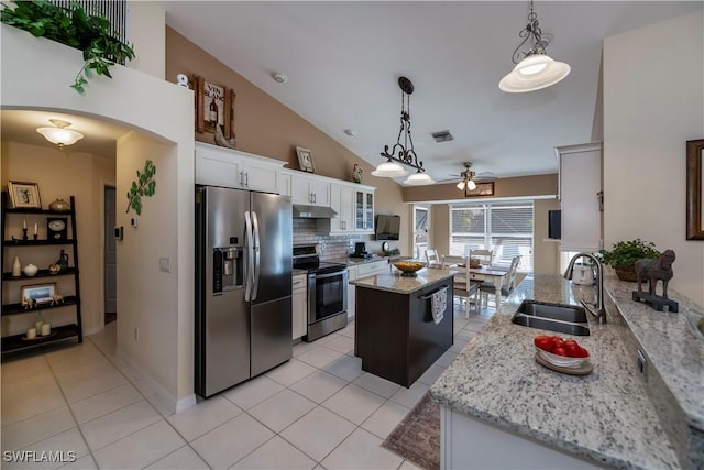 kitchen featuring stainless steel appliances, a center island, ceiling fan, white cabinets, and sink