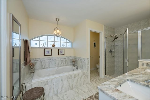 full bathroom featuring toilet, vanity, an inviting chandelier, and independent shower and bath