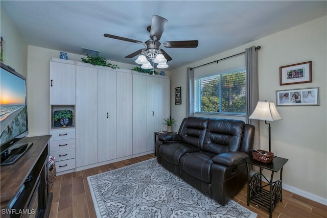 living room with ceiling fan