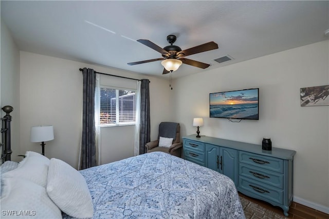 bedroom featuring ceiling fan and dark hardwood / wood-style floors