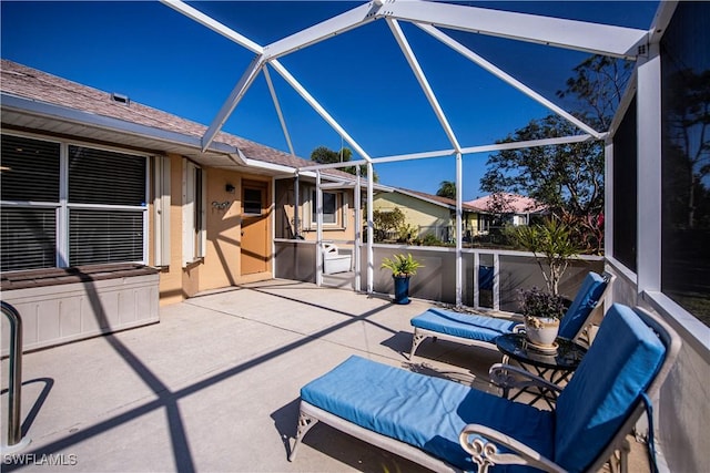 view of patio with a lanai