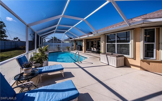 view of pool featuring a lanai and a patio area